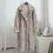 Manteau blanc fausse fourrure léopard.