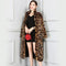 Manteau long fausse fourrure.