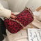 Pochette léopard chaîne dorée rouge.