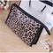 Pochette léopard maquillage.
