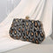 Pochette léopard sequins argenté.