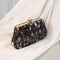 Pochette léopard noire à sequins.