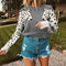 Pull femme imprimé léopard gris.