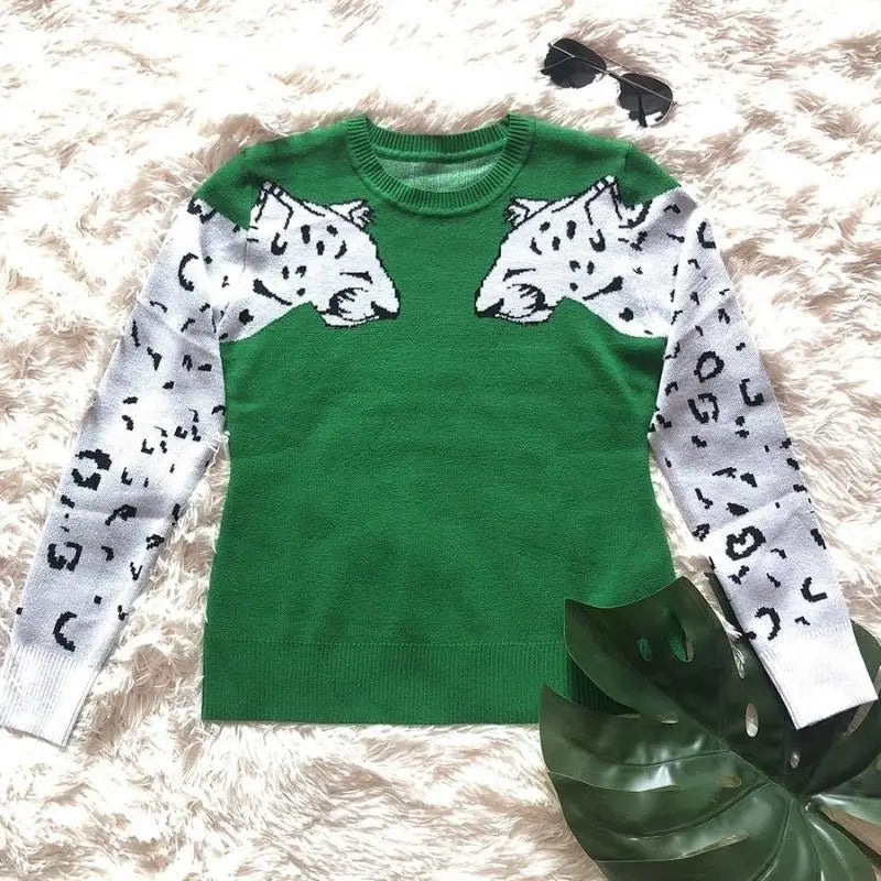 Pull vert léopard femme.
