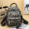 Sac à dos léopard beige.