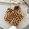 Sac léopard fausse fourrure beige.