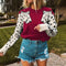 Pull femme bordeaux léopard.