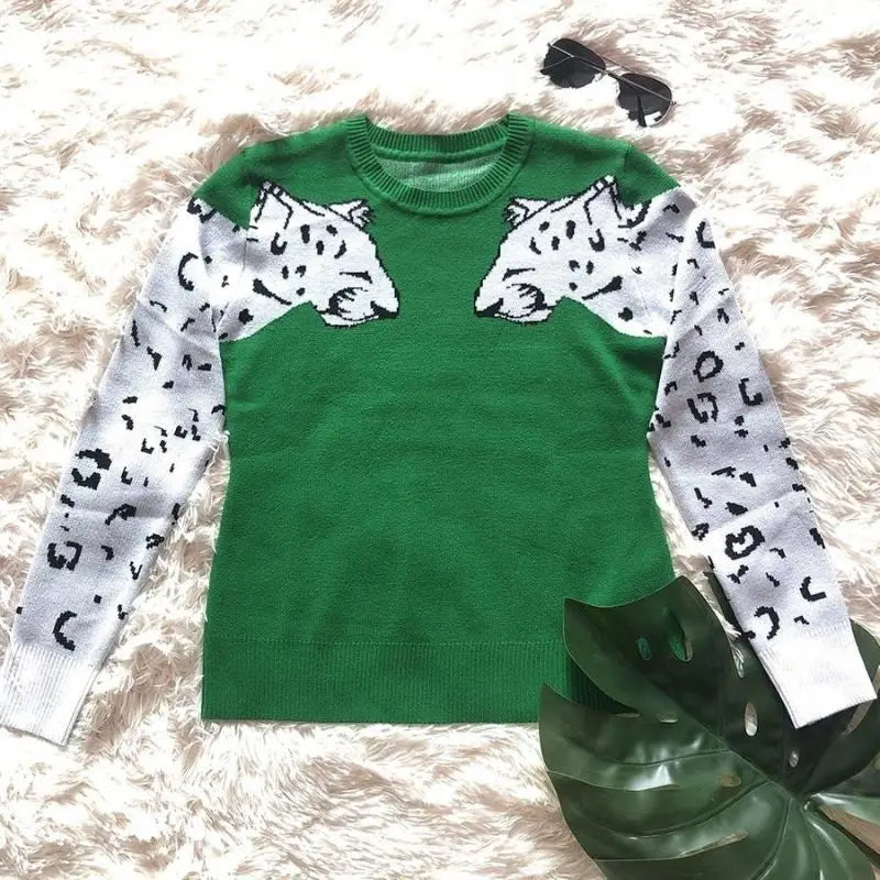 Pull femme léopard vert.
